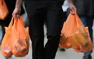 Shoppers leave a Sainsburys store with their purchases in plastic bags on February 29, 2008 in London, England. The Prime Minister Gordon Brown has stated that he will force retailers to help reduce the use of plastic bags if they do not do so voluntarily.